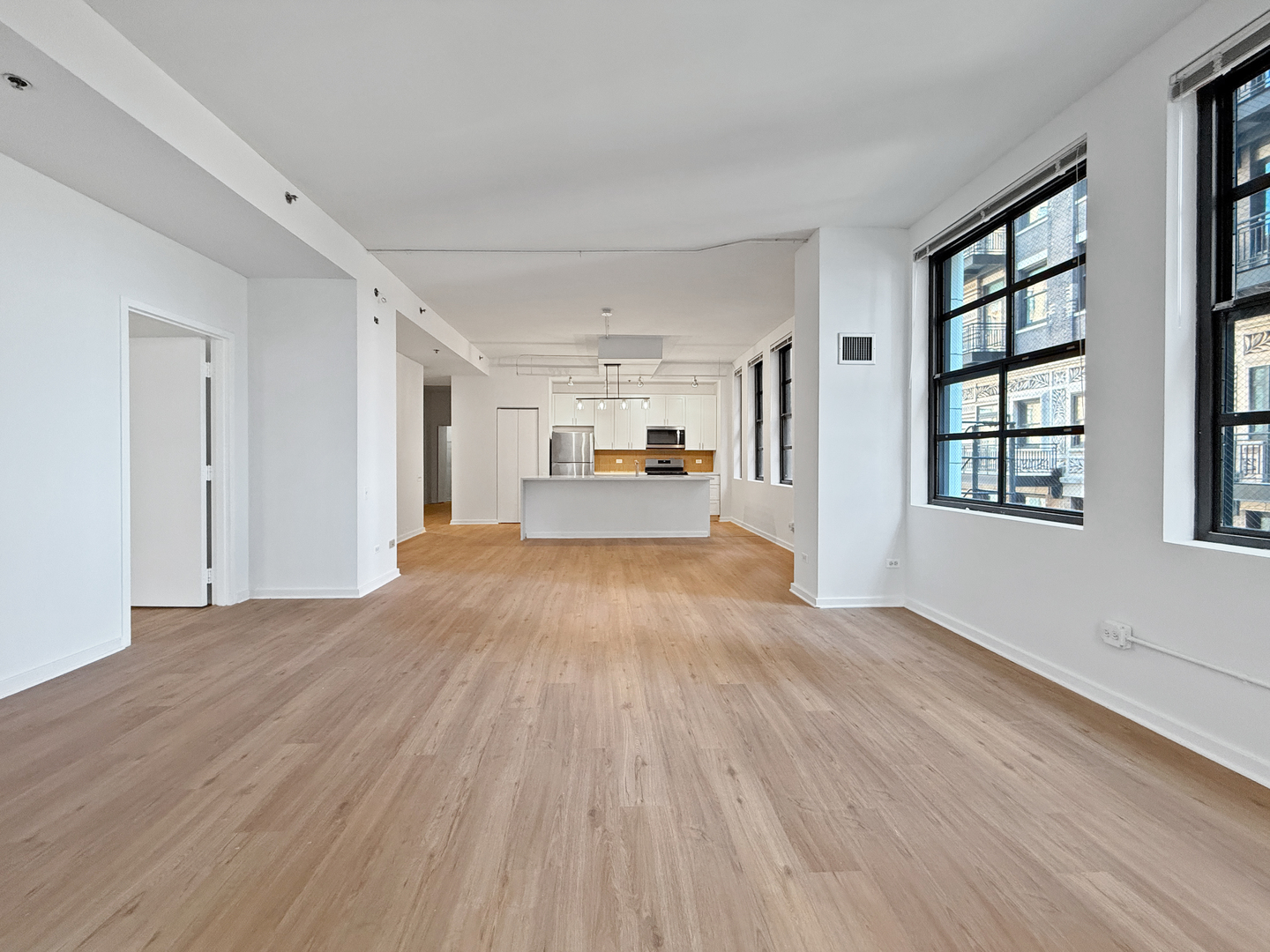 5 North Wabash Avenue, Unit 1201 Chicago, IL 60602 - Photo 15 of 33 a view of empty room with wooden floor and windows