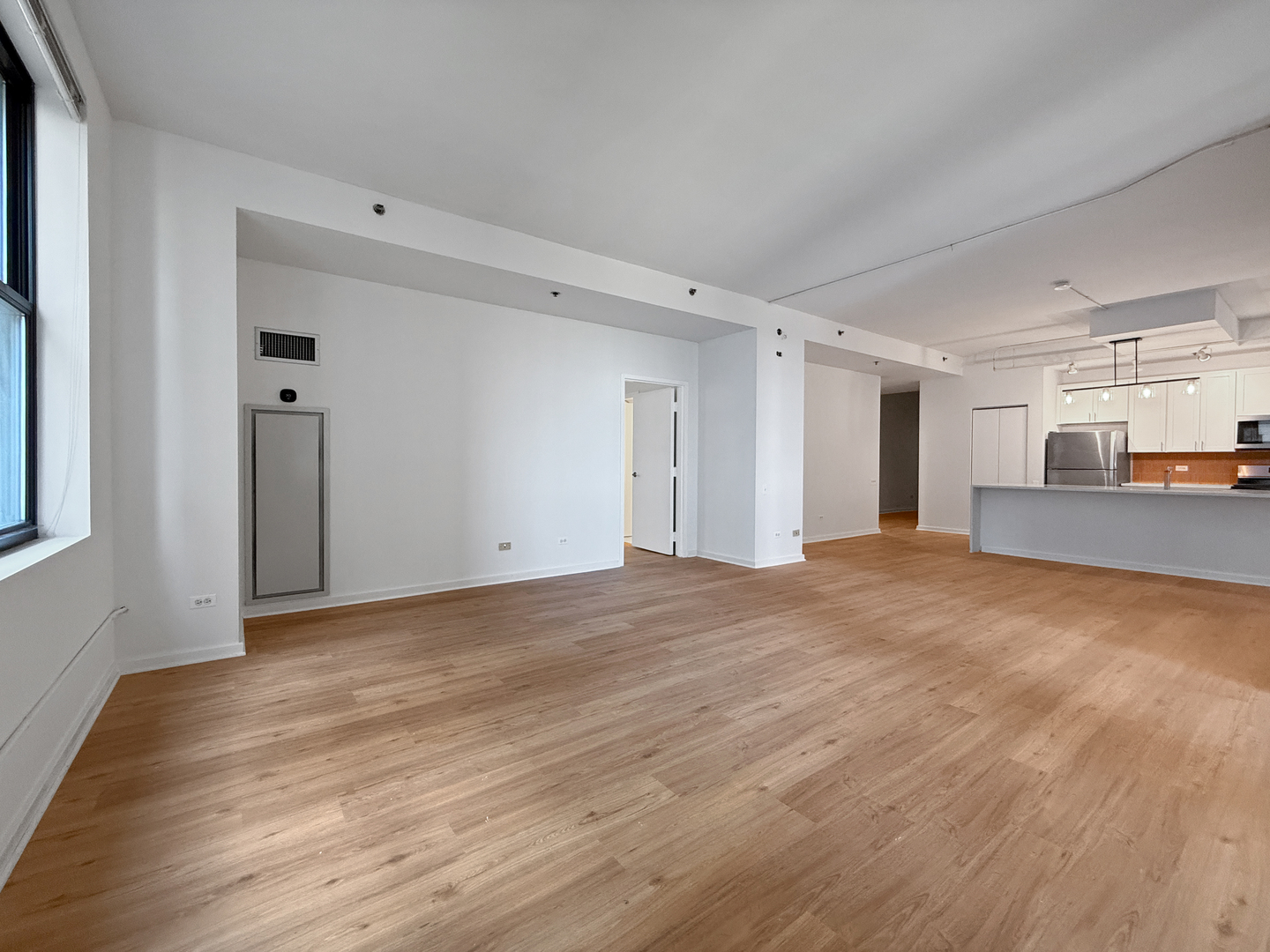 5 North Wabash Avenue, Unit 1201 Chicago, IL 60602 - Photo 16 of 33 a view of a big room with wooden floor and a window