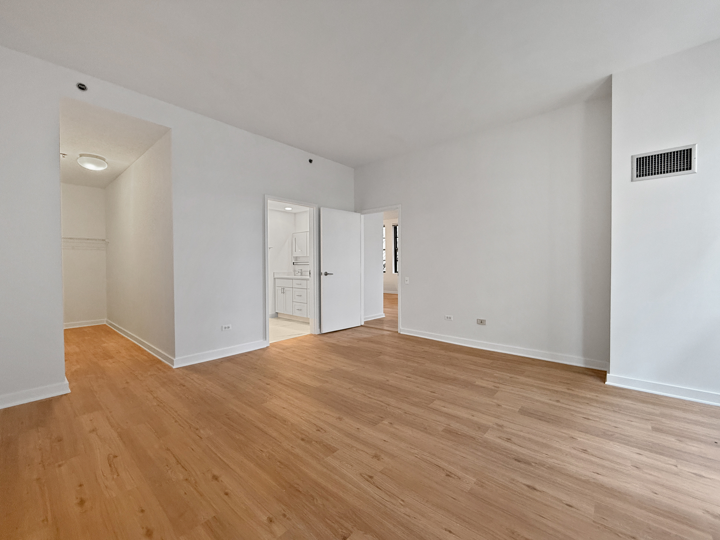 5 North Wabash Avenue, Unit 1201 Chicago, IL 60602 - Photo 18 of 33 a view of an empty room with wooden floor