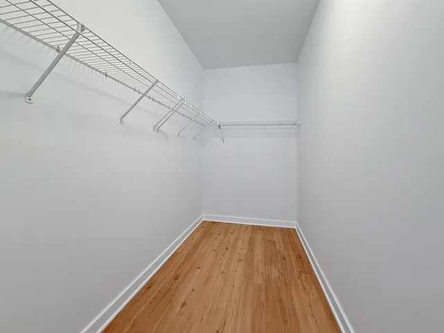 a bathroom with a sink and a mirror with toilet