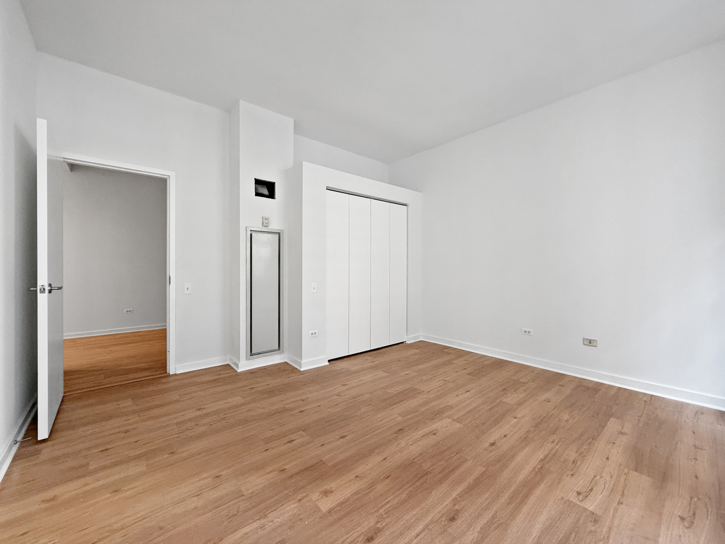 5 North Wabash Avenue, Unit 1201 Chicago, IL 60602 - Photo 26 of 33 a view of an empty room with wooden floor