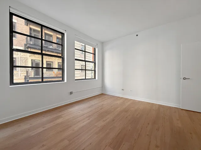 wooden floor with white walls