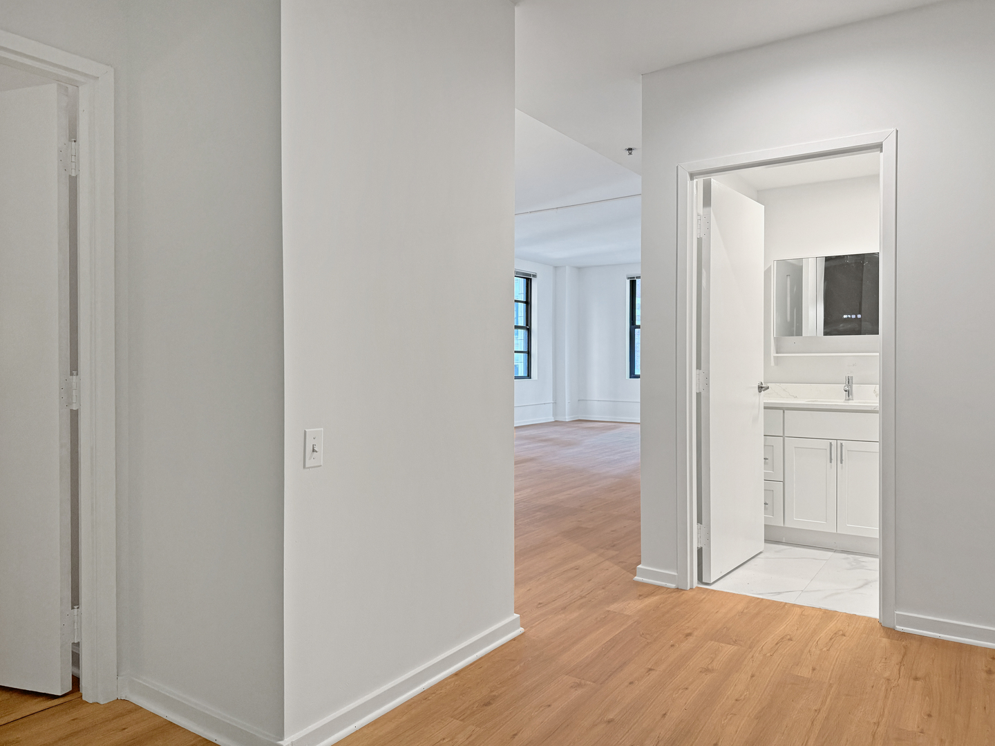 5 North Wabash Avenue, Unit 1201 Chicago, IL 60602 - Photo 30 of 33 wooden floor with white walls