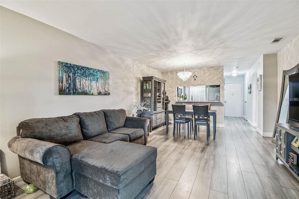 9613 Midiron Court, Unit 39A New Port Richey, FL 34655 - Photo 15 of 76 a living room with furniture and a wooden floor