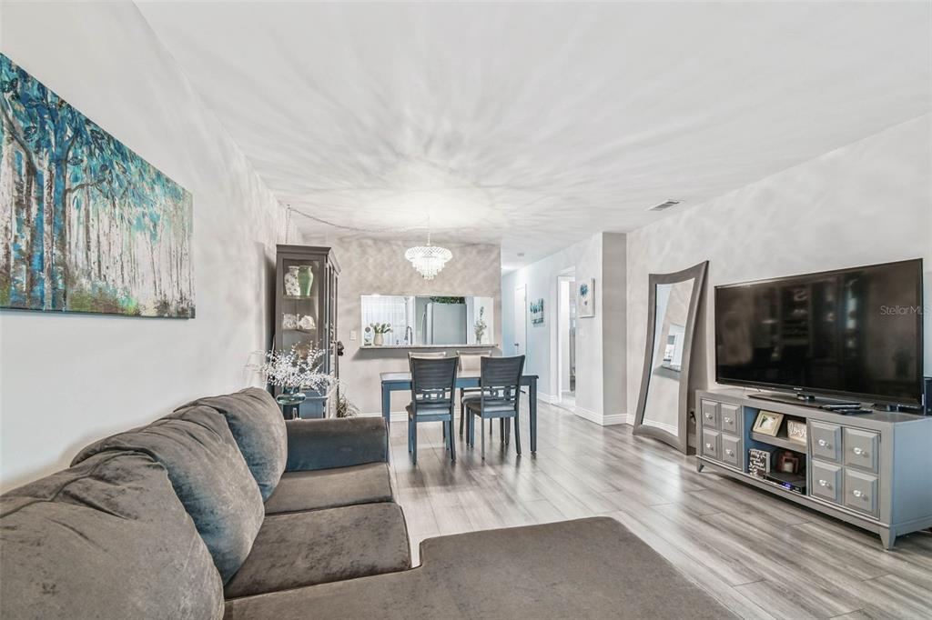 9613 Midiron Court, Unit 39A New Port Richey, FL 34655 - Photo 16 of 76 a living room with furniture and a flat screen tv