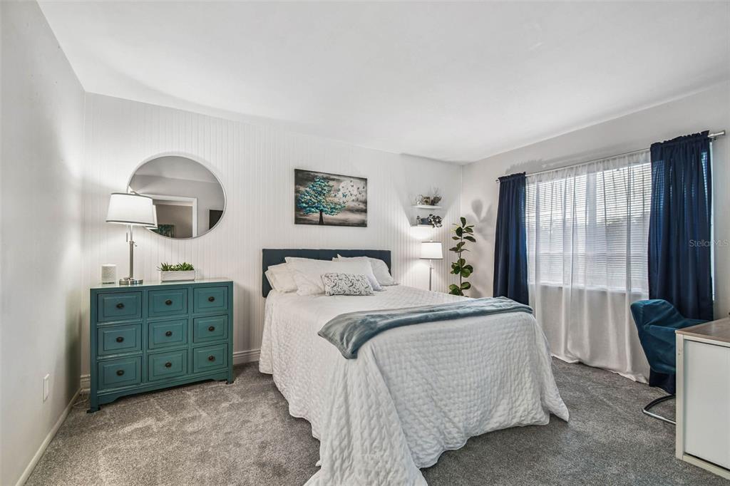 9613 Midiron Court, Unit 39A New Port Richey, FL 34655 - Photo 23 of 76 a spacious bedroom with a bed and a dresser