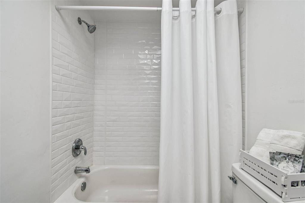 9613 Midiron Court, Unit 39A New Port Richey, FL 34655 - Photo 29 of 76 a bathroom with a tub and shower