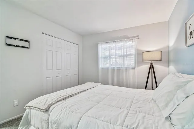 an aerial view of a swimming pool with a yard