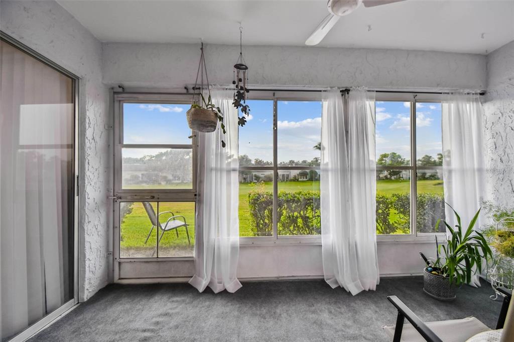 9613 Midiron Court, Unit 39A New Port Richey, FL 34655 - Photo 39 of 76 a view of hallway with furniture and a potted plant