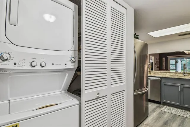 an aerial view of a swimming pool with outdoor seating