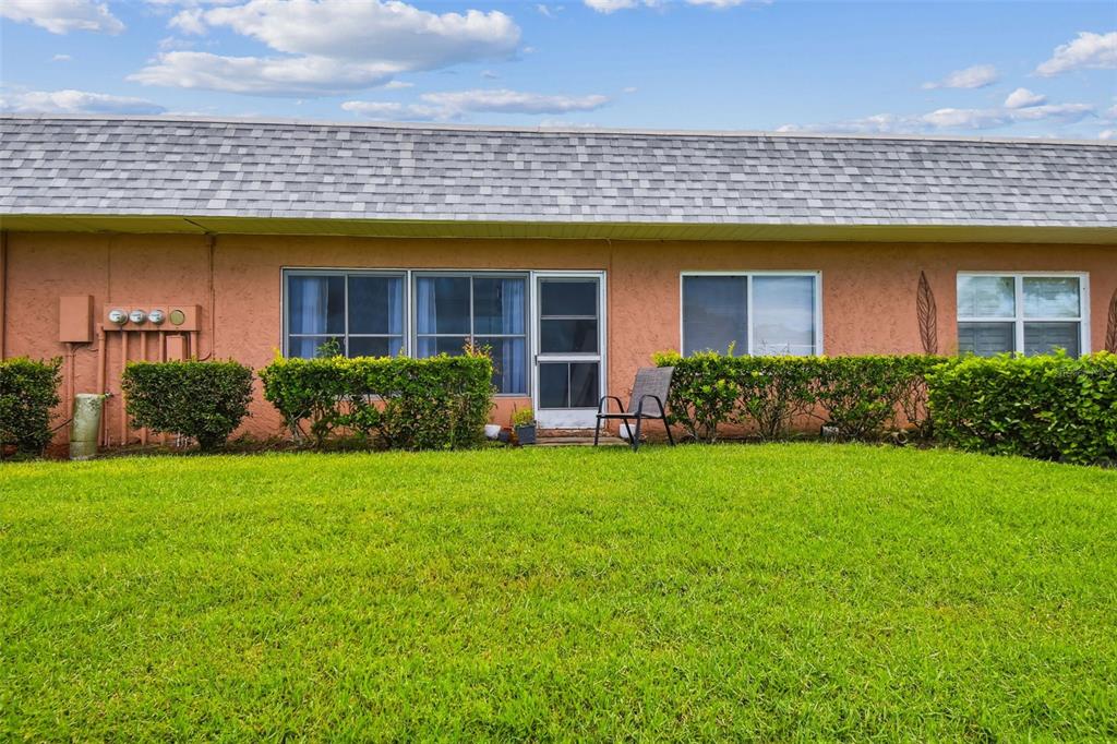 9613 Midiron Court, Unit 39A New Port Richey, FL 34655 - Photo 43 of 76 front view of a house with a yard