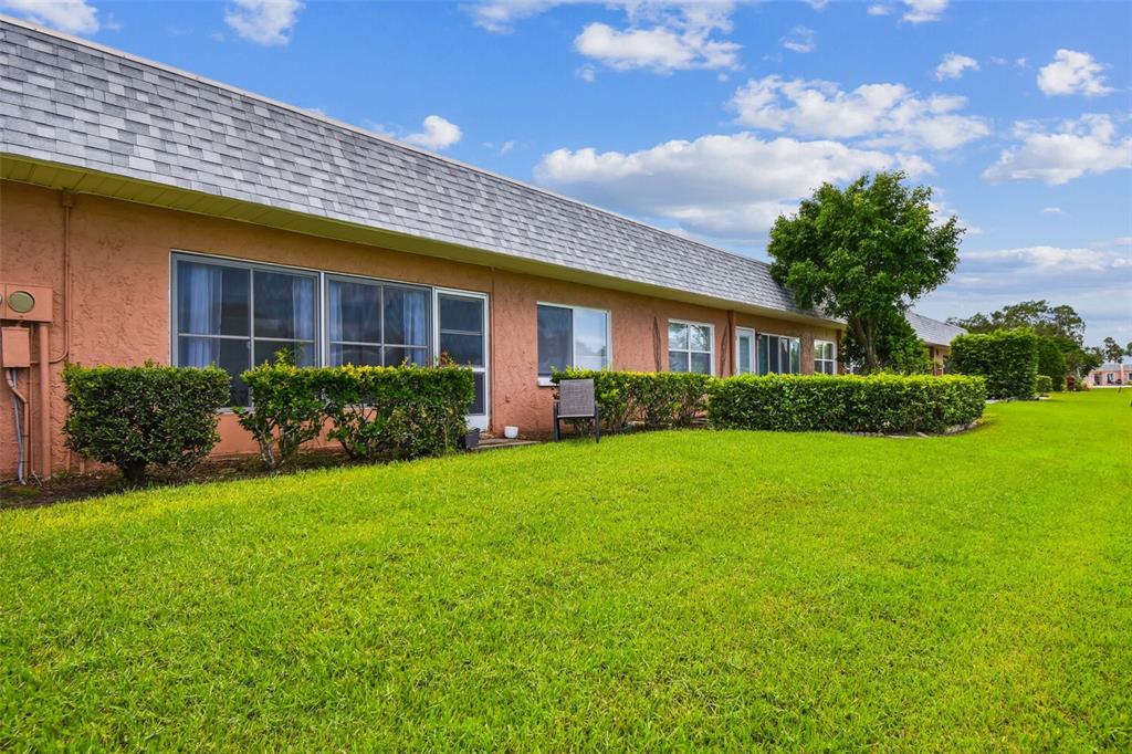 9613 Midiron Court, Unit 39A New Port Richey, FL 34655 - Photo 44 of 76 a front view of a house with garden