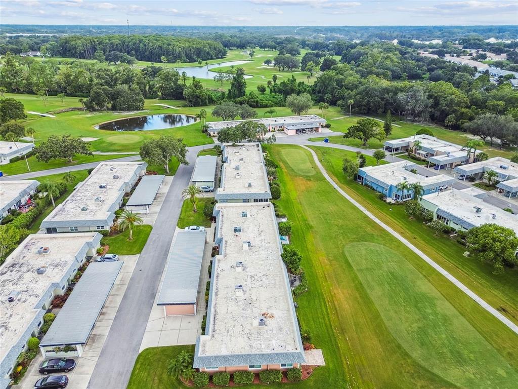 9613 Midiron Court, Unit 39A New Port Richey, FL 34655 - Photo 47 of 76 an aerial view of a swimming pool with a yard