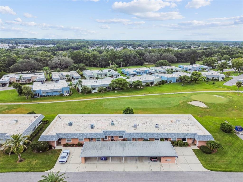 9613 Midiron Court, Unit 39A New Port Richey, FL 34655 - Photo 52 of 76 a aerial view of a house with a big yard