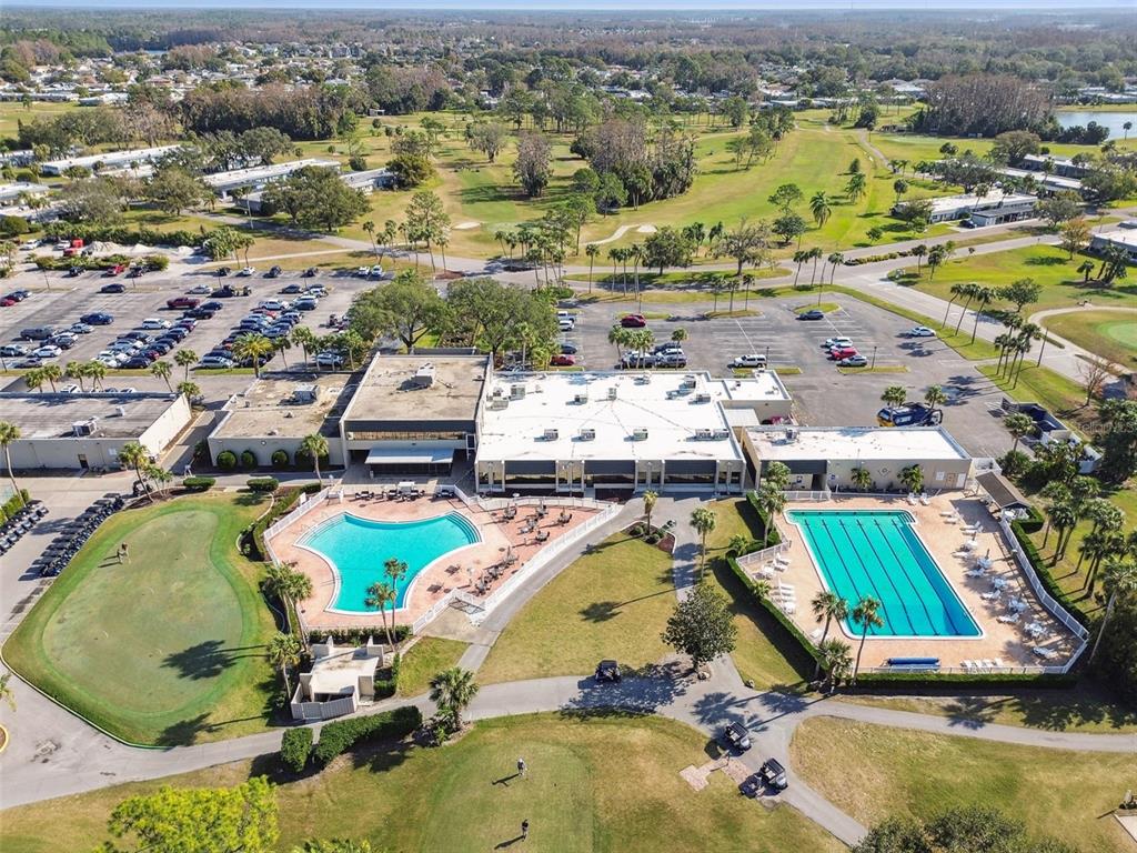 9613 Midiron Court, Unit 39A New Port Richey, FL 34655 - Photo 61 of 76 an aerial view of a swimming pool with outdoor seating