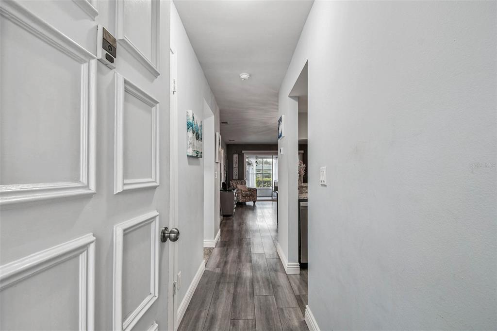 9613 Midiron Court, Unit 39A New Port Richey, FL 34655 - Photo 8 of 76 a view of a hallway with wooden floor and staircase