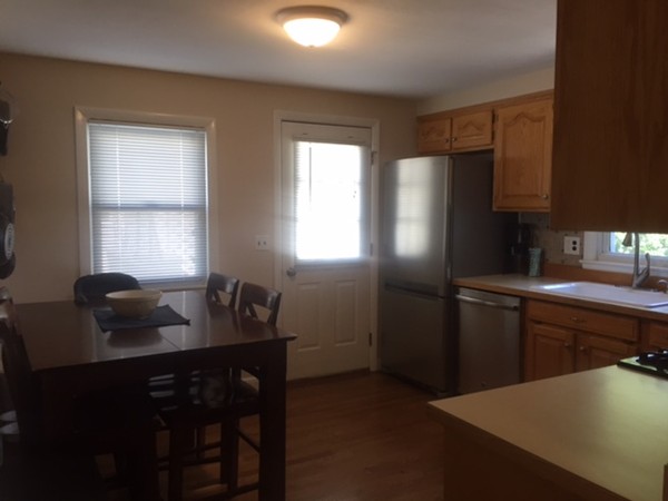 31 Spring View Drive Lynn, MA 01904 - Photo 4 of 12 a kitchen with a refrigerator and furniture