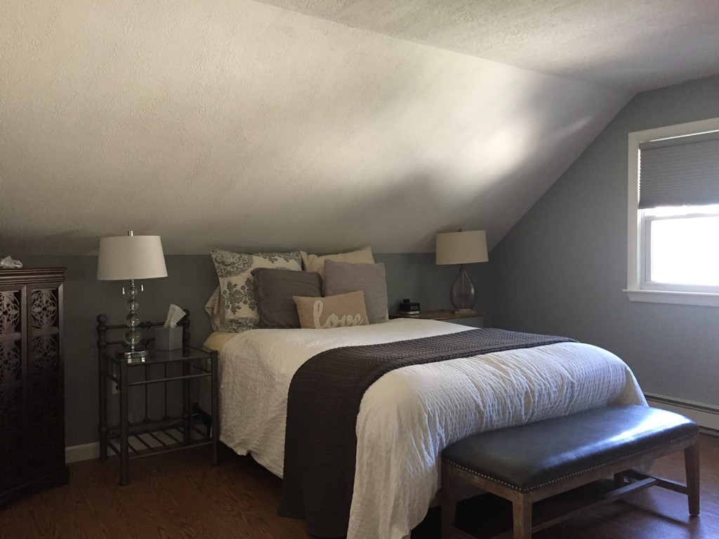 31 Spring View Drive Lynn, MA 01904 - Photo 7 of 12 a bedroom with a bed and a lamp