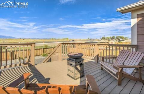 6564 Watusi Road Peyton, CO 80831 - Photo 7 of 12 a view of a balcony with lake view and mountain view
