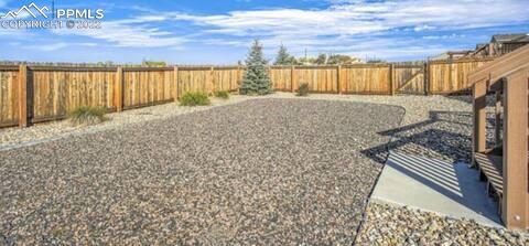 6564 Watusi Road Peyton, CO 80831 - Photo 8 of 12 a view of an outdoor space and a window