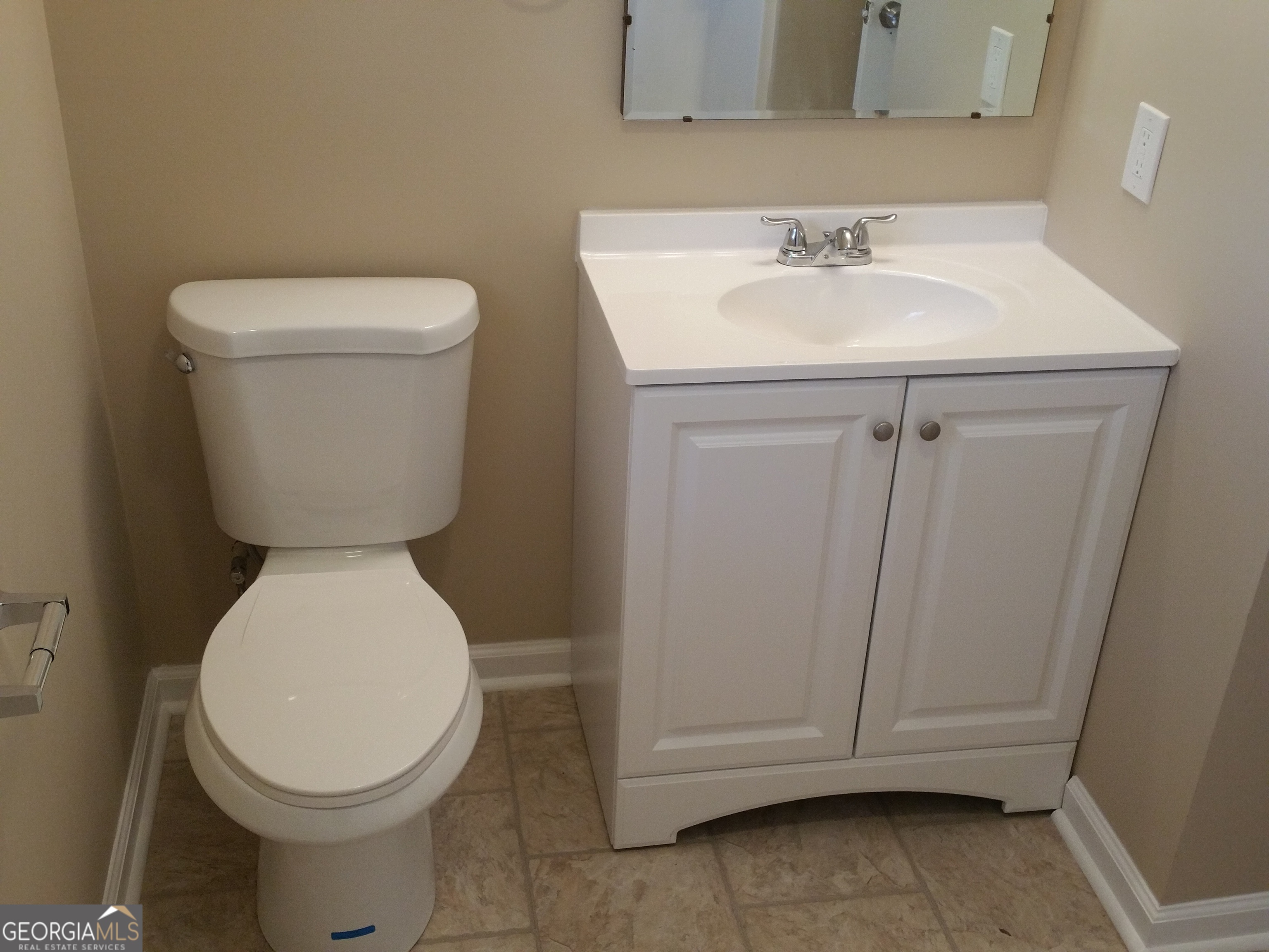 61 Tram Track Road Rome, GA 30161 - Photo 4 of 10 a bathroom with a toilet sink and mirror