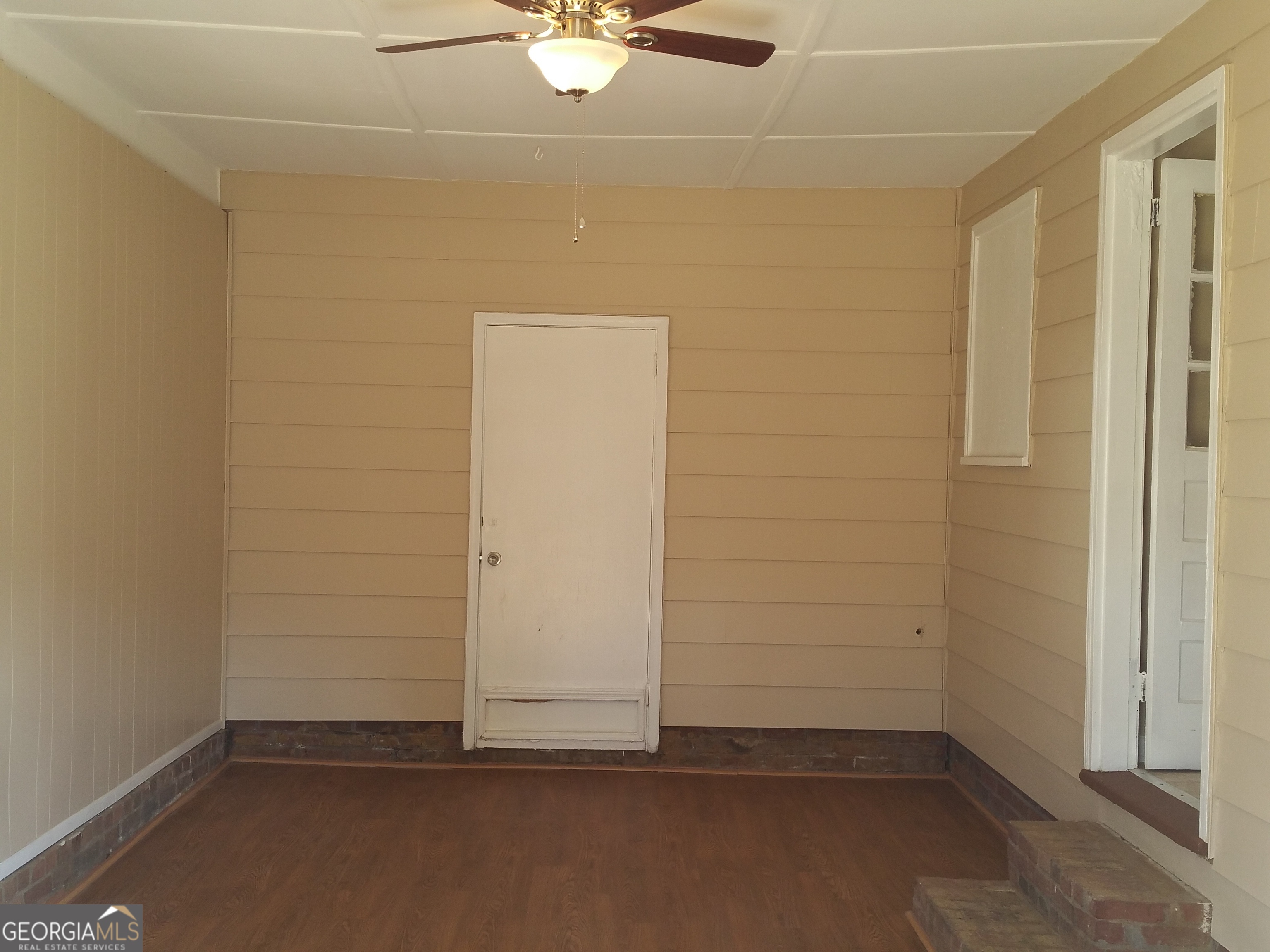 61 Tram Track Road Rome, GA 30161 - Photo 7 of 10 an empty room with a ceiling fan and carpet