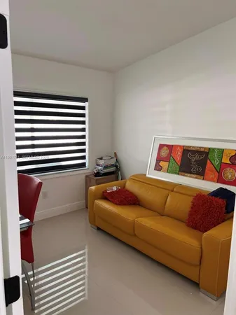 a bedroom with a bed and a book shelf