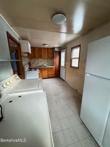 a view of livingroom with hardwood floor and a window