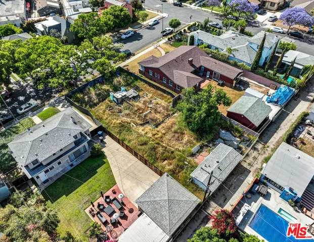 an aerial view of a house with a garden