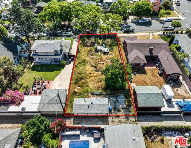an aerial view of a house with a garden