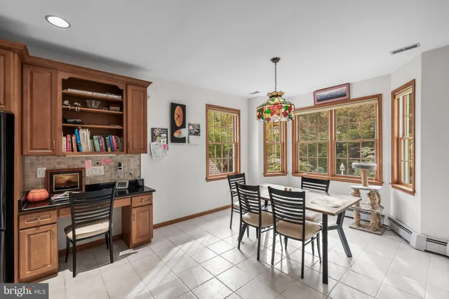 a dining room with furniture and window