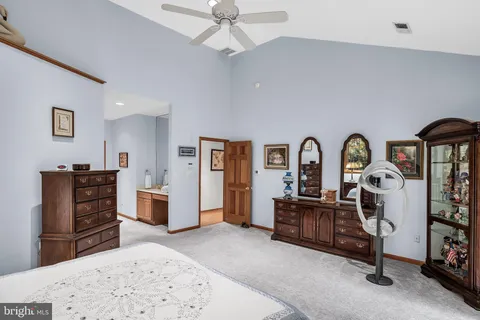 a bedroom with furniture and natural light