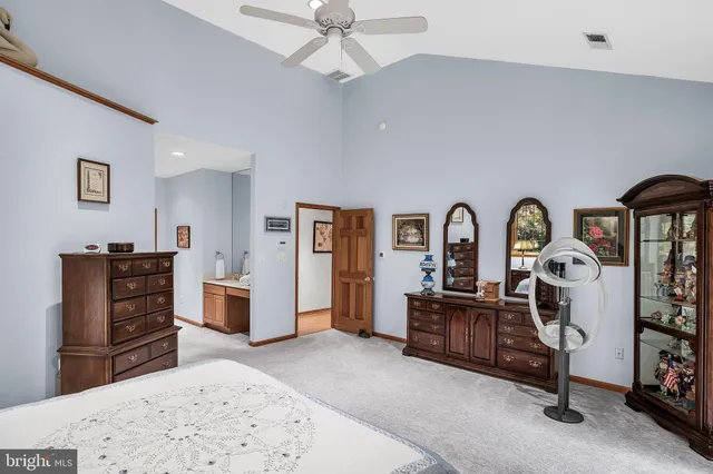 a bedroom with furniture and natural light