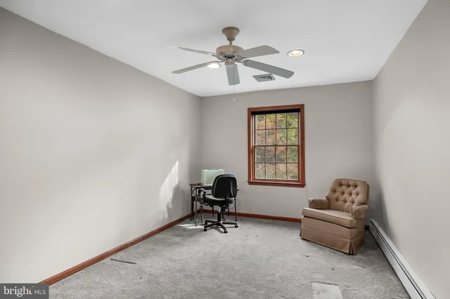 a workspace with furniture and a window