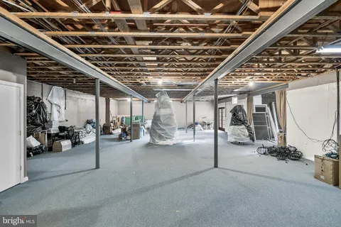 a front view of a house with yard and green space