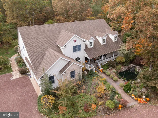 an aerial view of residential house with outdoor space