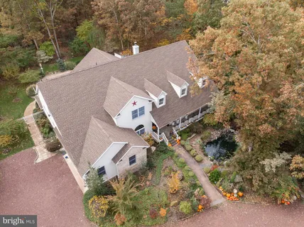 an aerial view of residential house with outdoor space