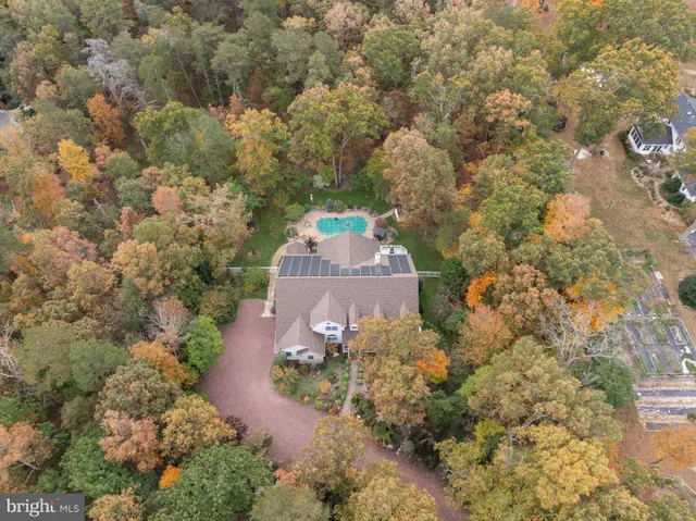 an aerial view of house with yard