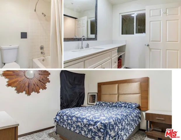 a bedroom with a bed and a large mirror