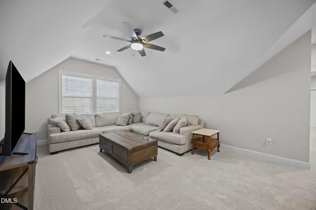 a view of a swimming pool with a table and chairs