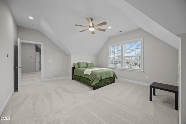 a view of a swimming pool with a garden and plants