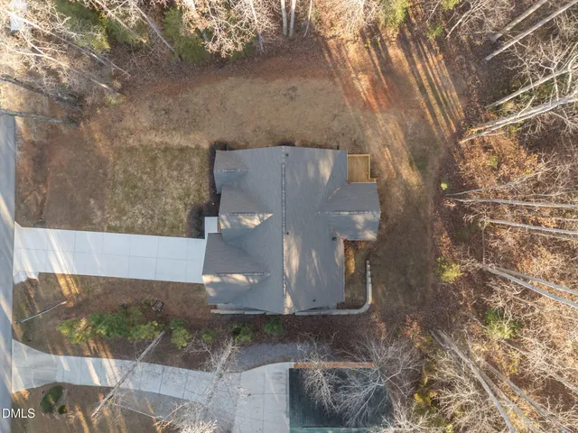 an aerial view of a house with a lake view