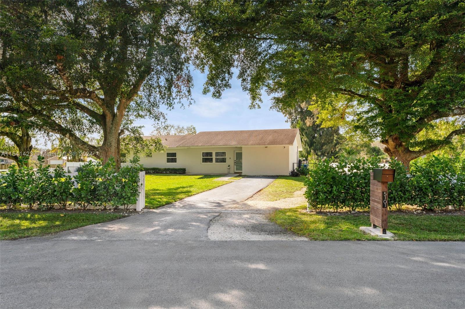 5101 Southwest 199th Avenue Southwest Ranches, FL 33332 - Photo 1 of 22 a house view with a outdoor space