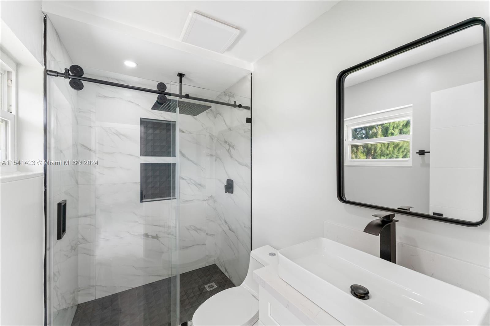 5101 Southwest 199th Avenue Southwest Ranches, FL 33332 - Photo 12 of 22 a bathroom with a sink toilet and shower