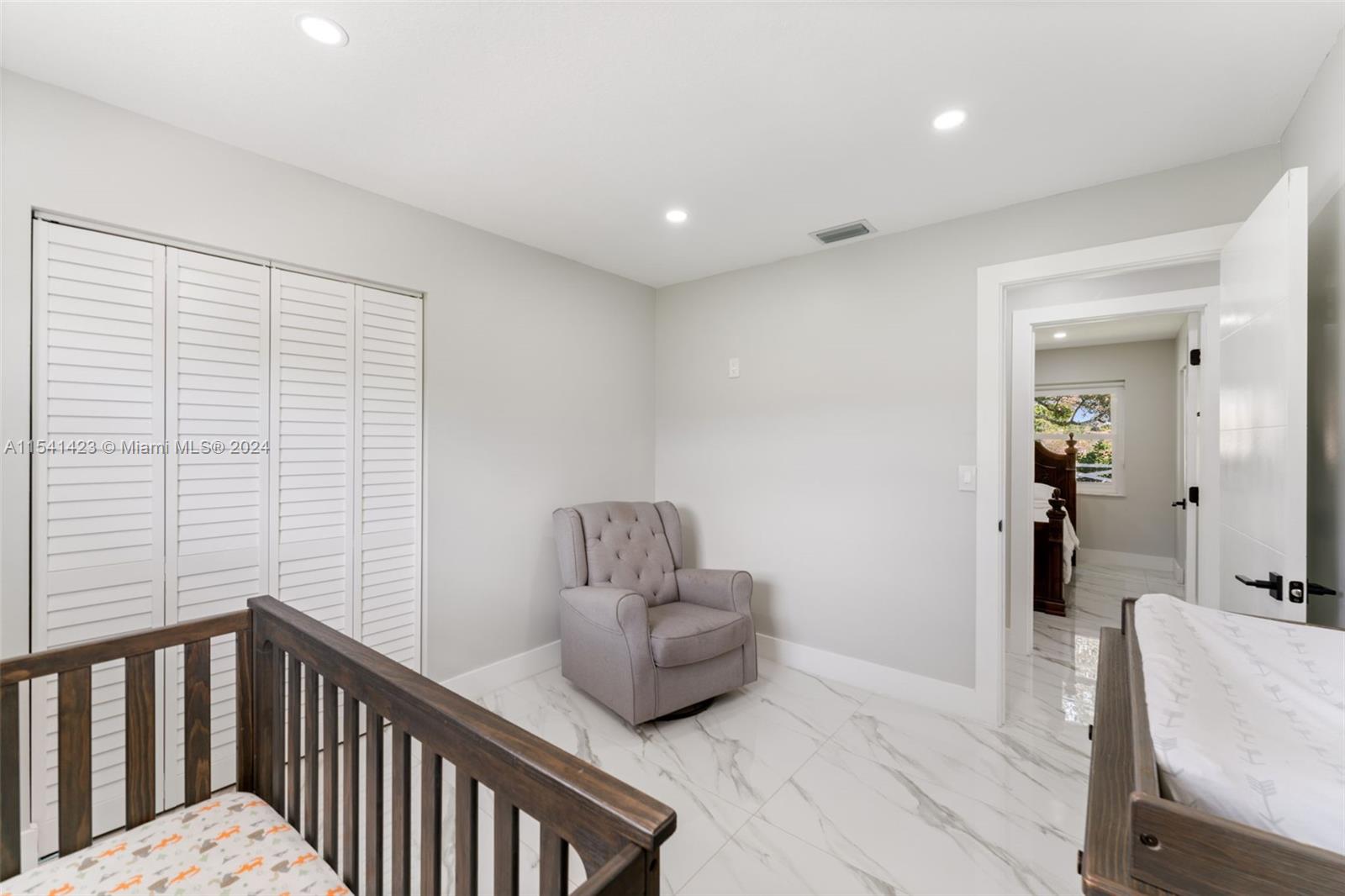 5101 Southwest 199th Avenue Southwest Ranches, FL 33332 - Photo 14 of 22 a hallway with a couch and wooden floor
