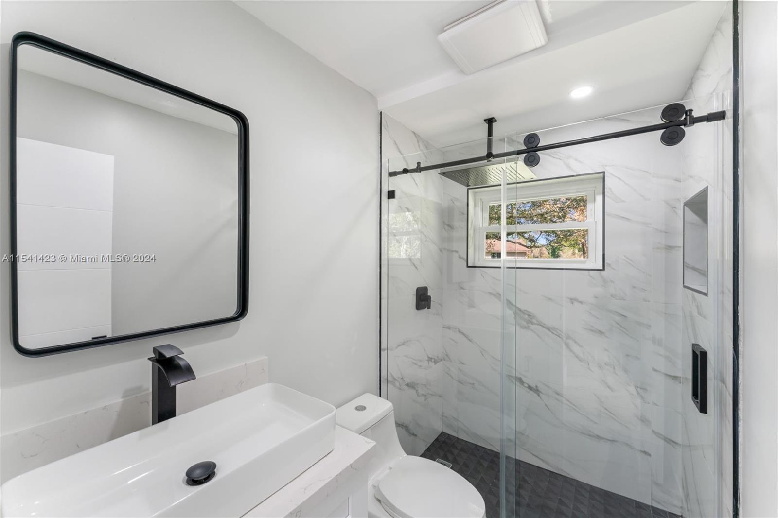 5101 Southwest 199th Avenue Southwest Ranches, FL 33332 - Photo 19 of 22 a bathroom with a toilet sink and shower