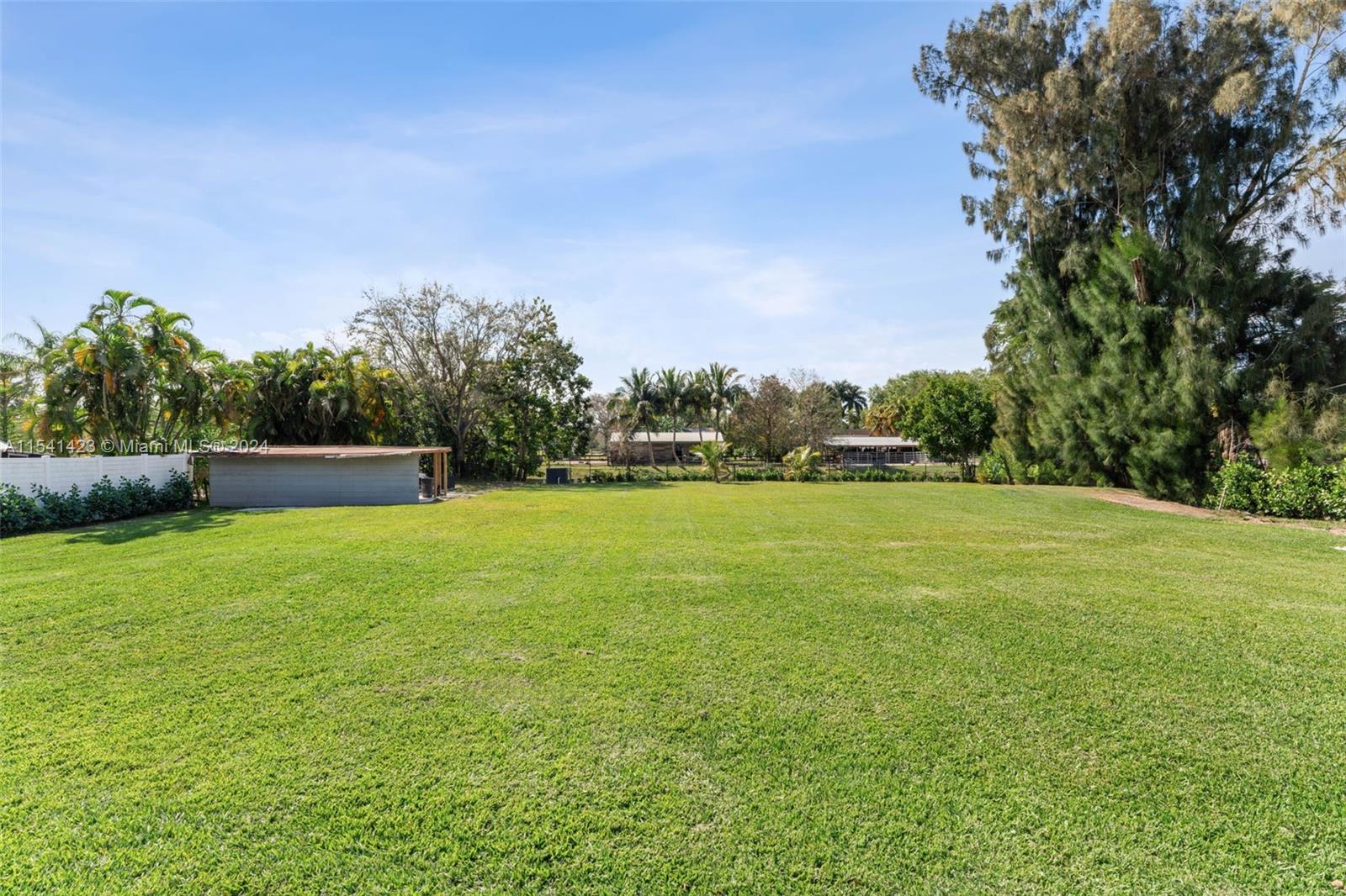 5101 Southwest 199th Avenue Southwest Ranches, FL 33332 - Photo 20 of 22 a view of yard with grass and trees