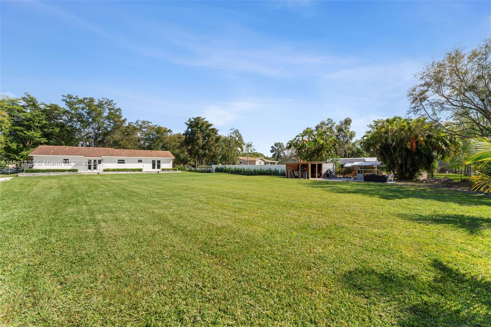 5101 Southwest 199th Avenue Southwest Ranches, FL 33332 - Photo 21 of 22 a view of a house with a big yard