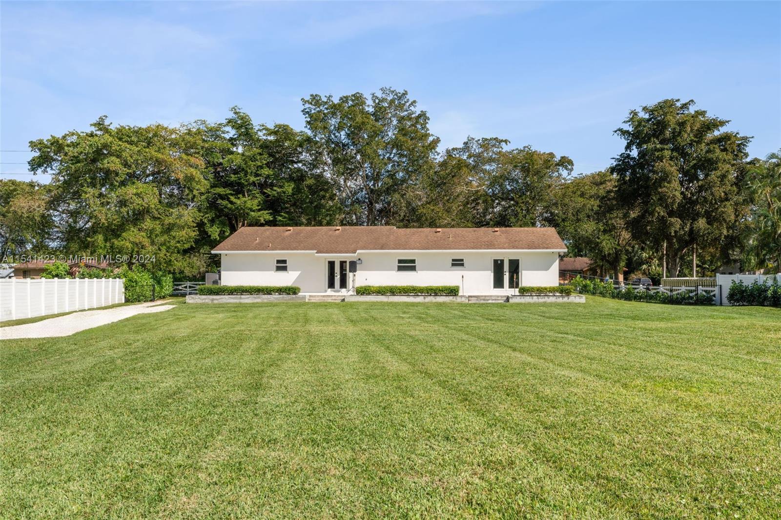 5101 Southwest 199th Avenue Southwest Ranches, FL 33332 - Photo 22 of 22 a view of a house with a back yard