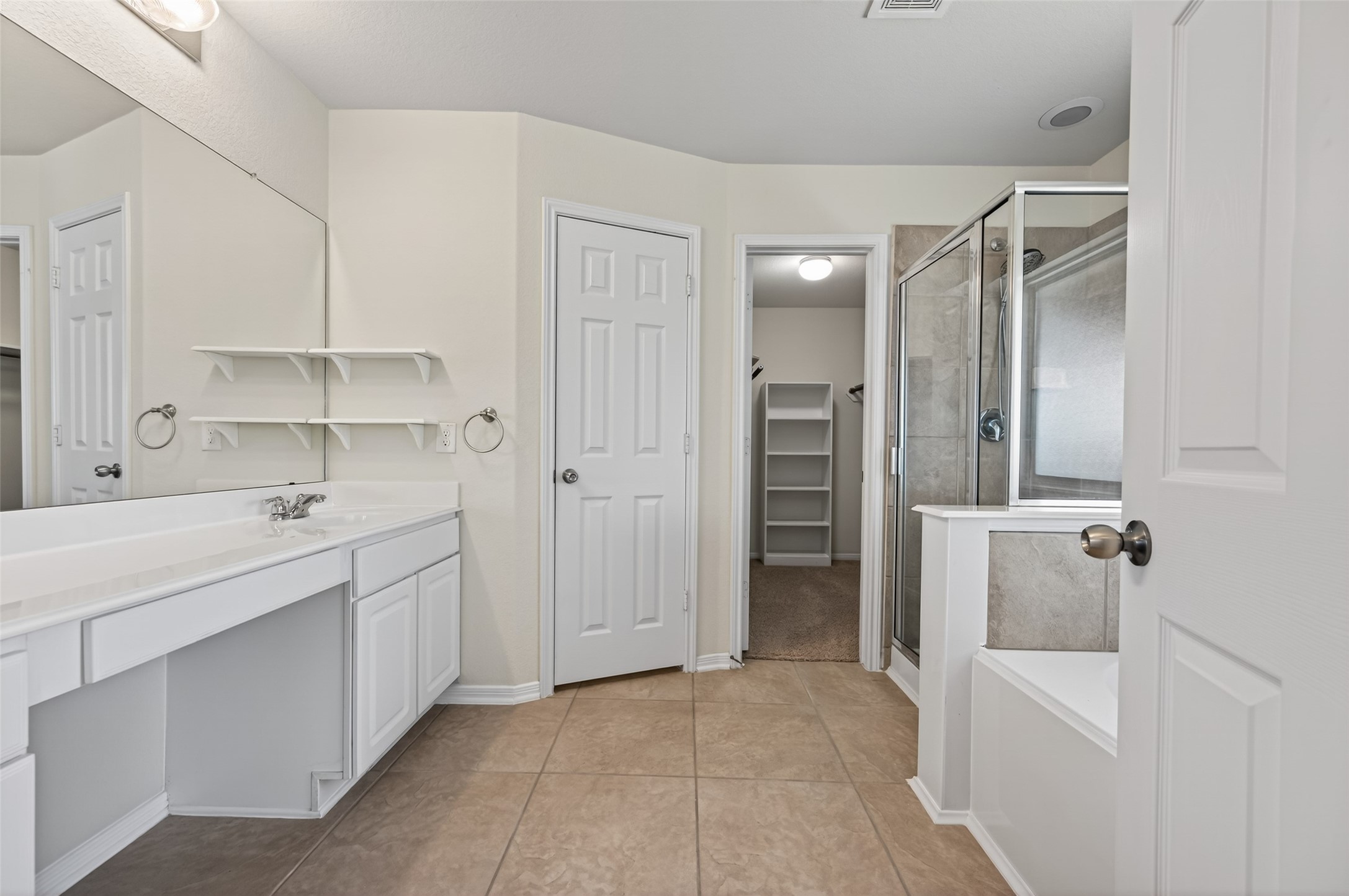 2487 Elm Crossing Trail Spring, TX 77386 - Photo 24 of 46 a bathroom with a tub sink and mirror
